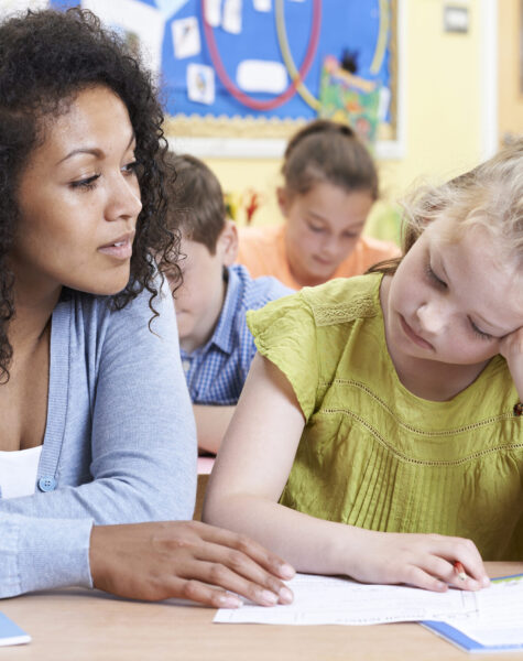 Teacher Female Elementary School Pupil With Problem