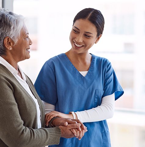 Shot of a young nurse caring for a senior woman