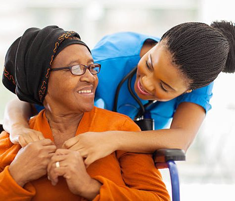 happy senior patient with friendly female nurse